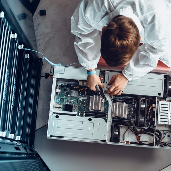 IT person working on server stack