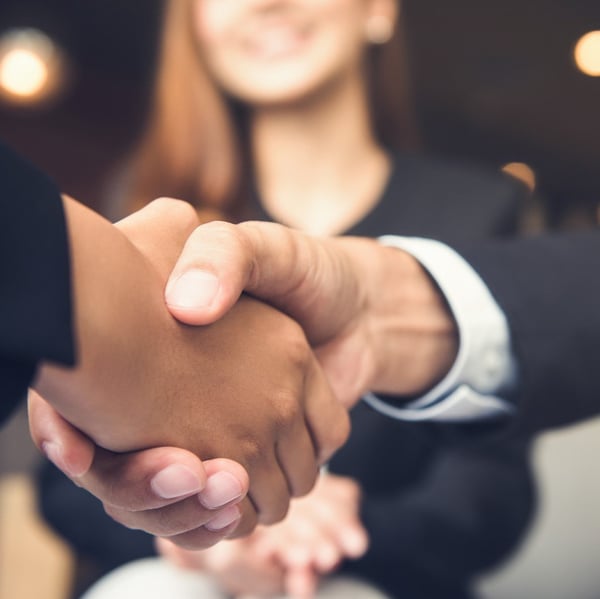 Close-up of business people shaking hands