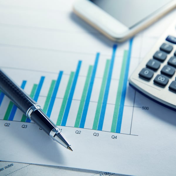 Pen on a sheet showing quarter results graphic