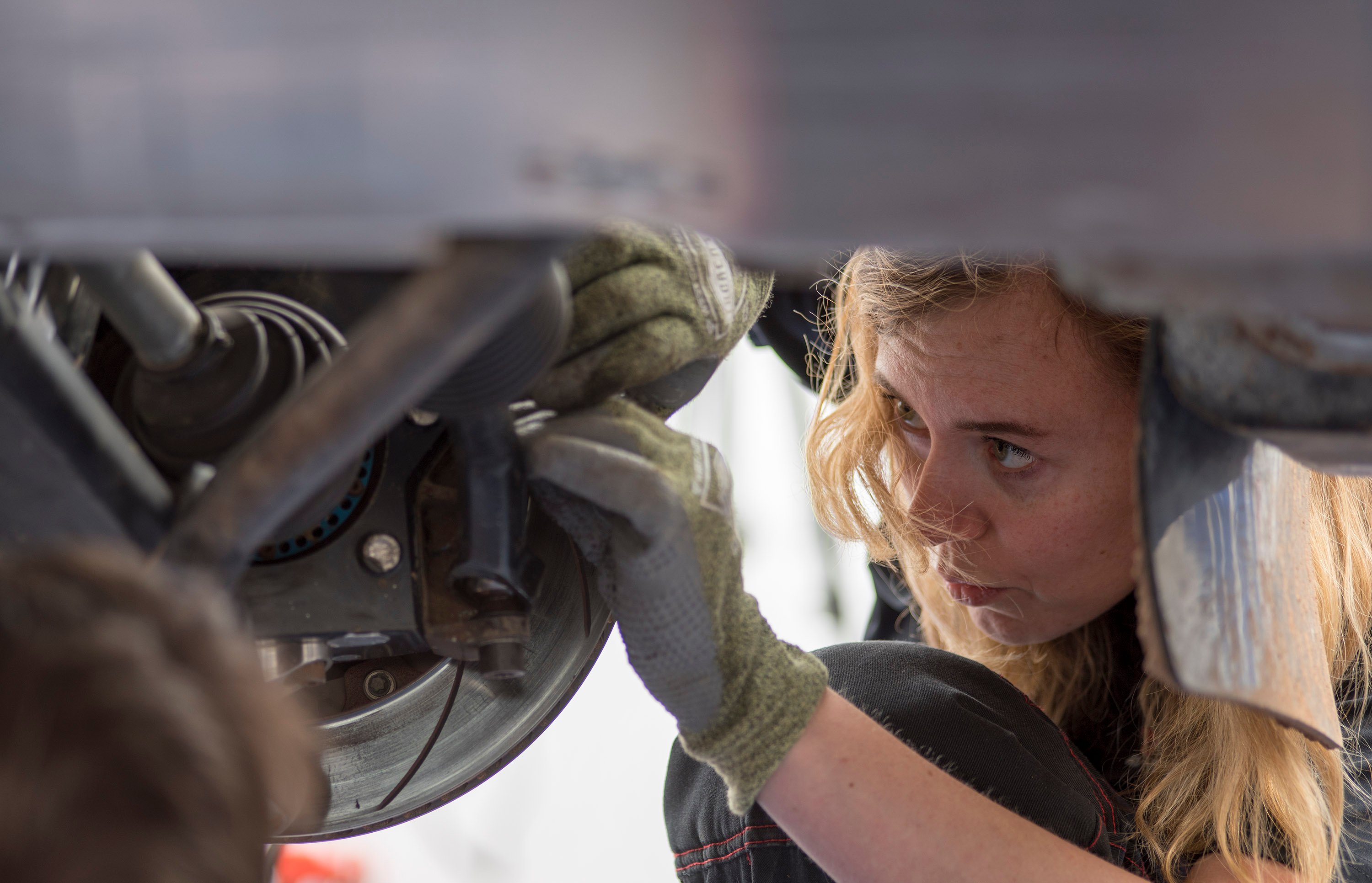 Leanne working on car