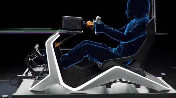 A man driving the BMW D-BOX Motion Platform