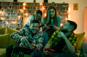 A group of friends having fun in a home entertainment room