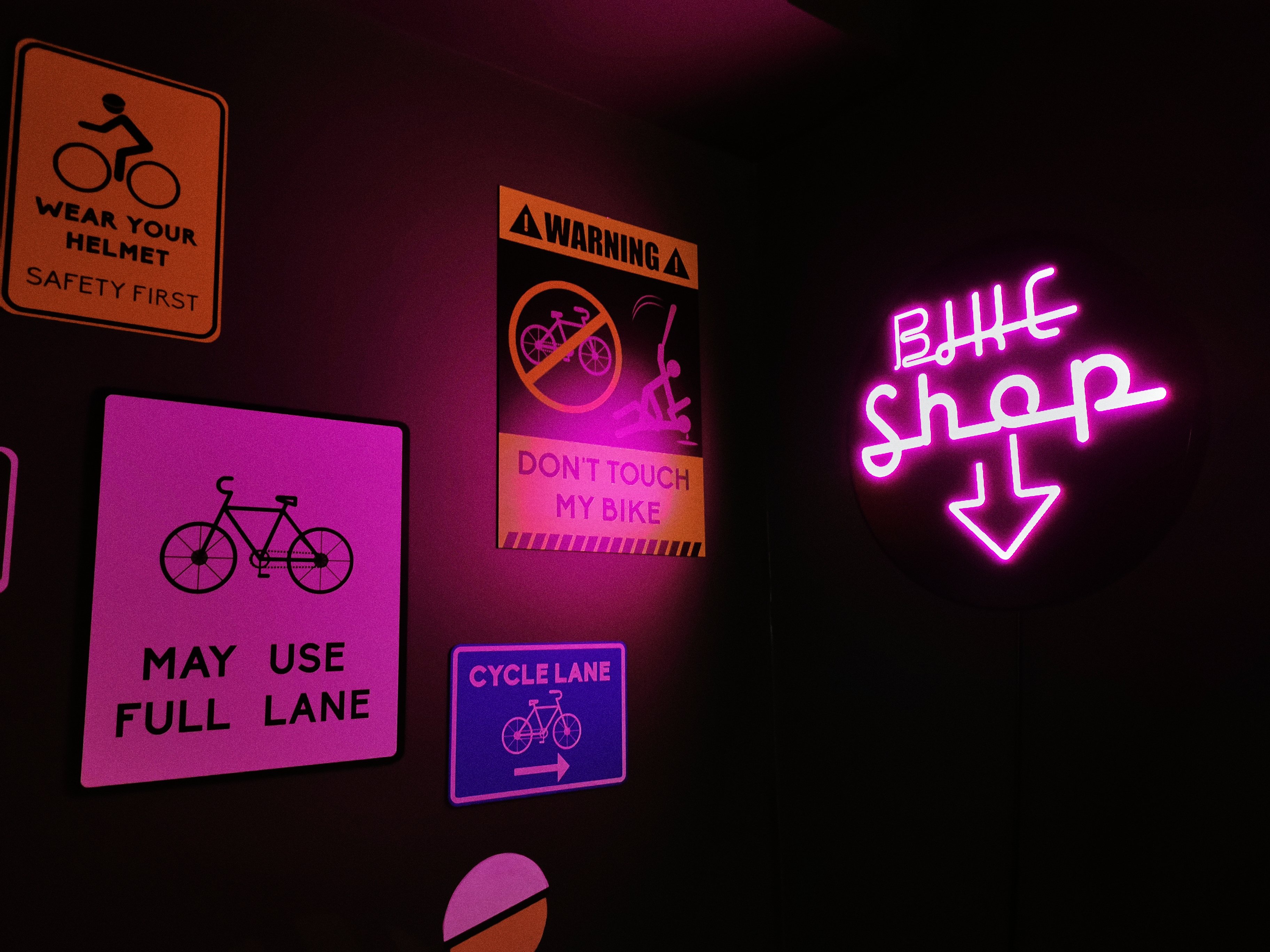 purple-and-pink-neon-sign-in-bicycle-shop-2022-11-14-19-25-40-utc