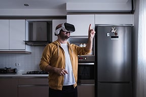 A man in the metaverse in his kitchen