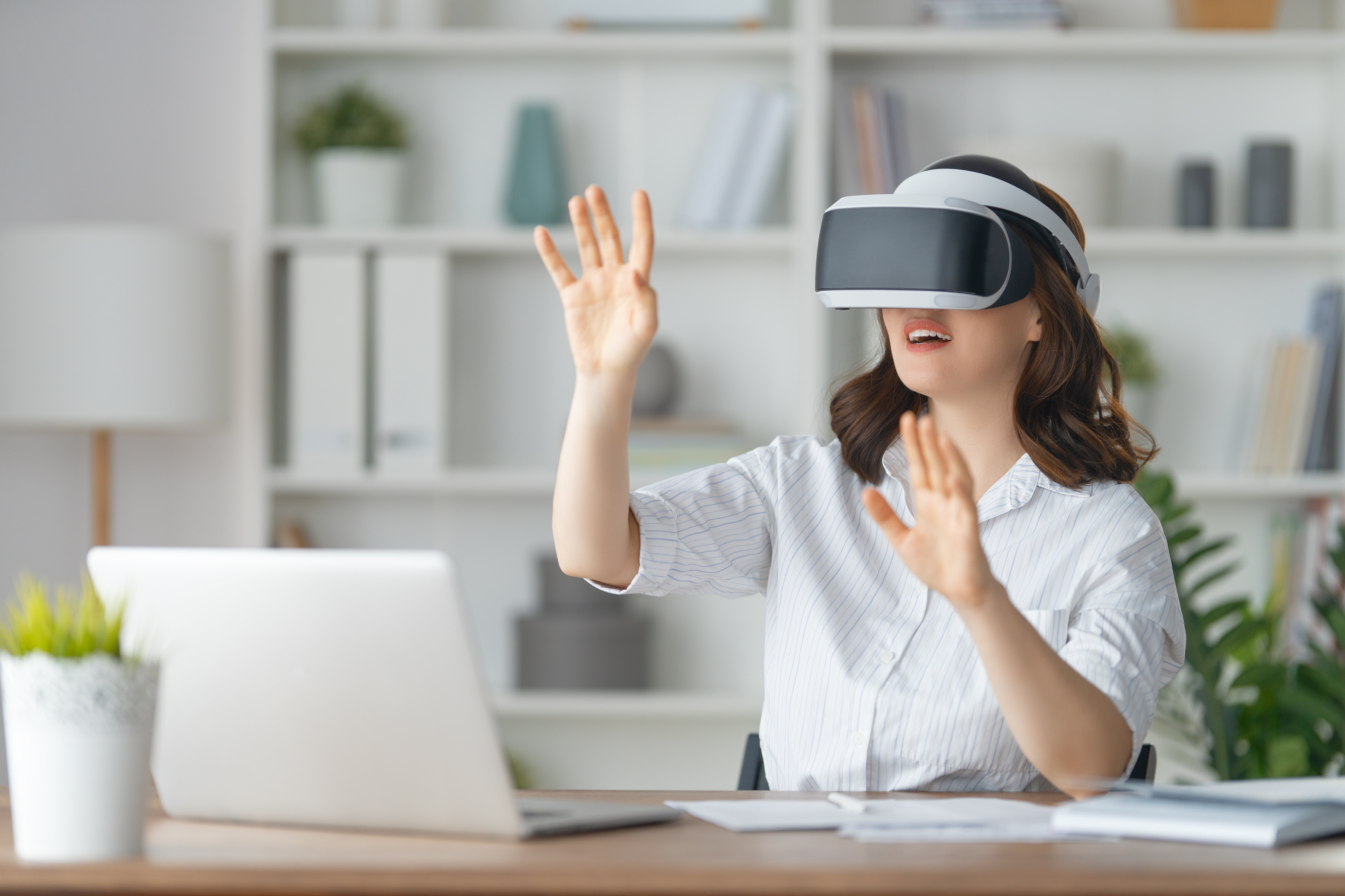 A woman wearing virtual reality goggles
