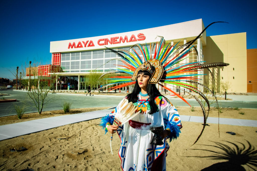An Aztec dancer outside of Maya Cinemas